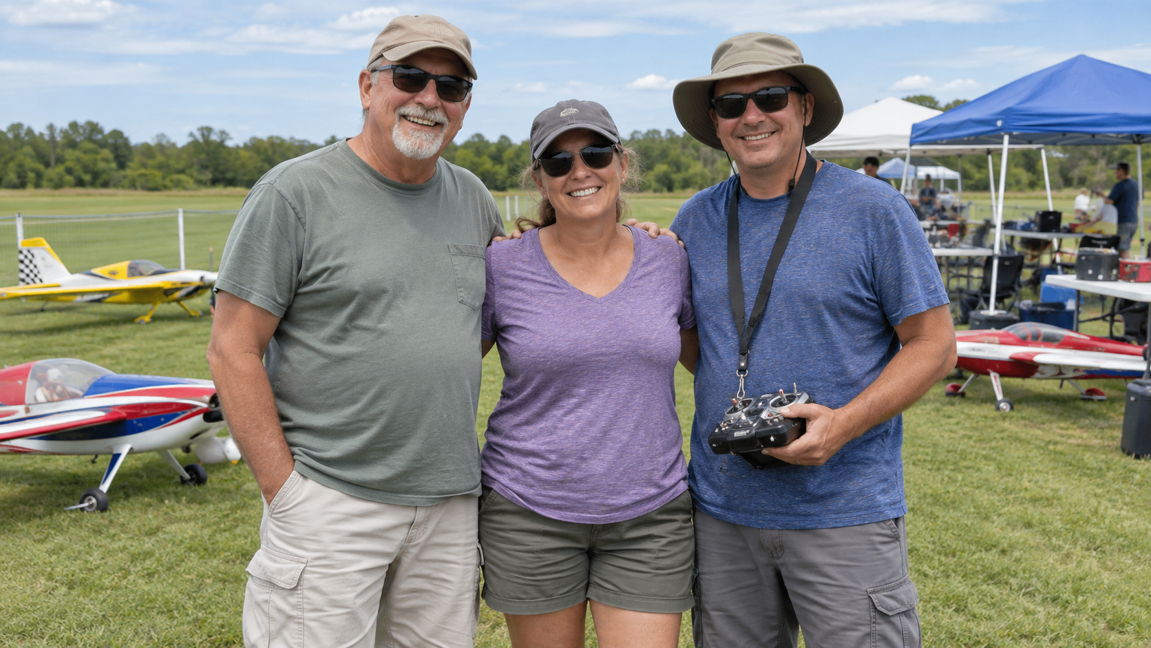 Three RC club members at a flying field